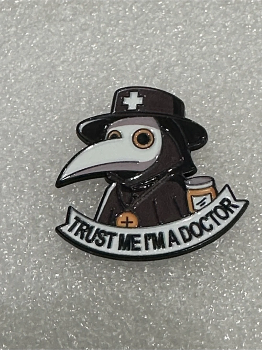 “Trust Me I’m A Doctor” Plague Doctor Enamel Pin - Black, White, Brown